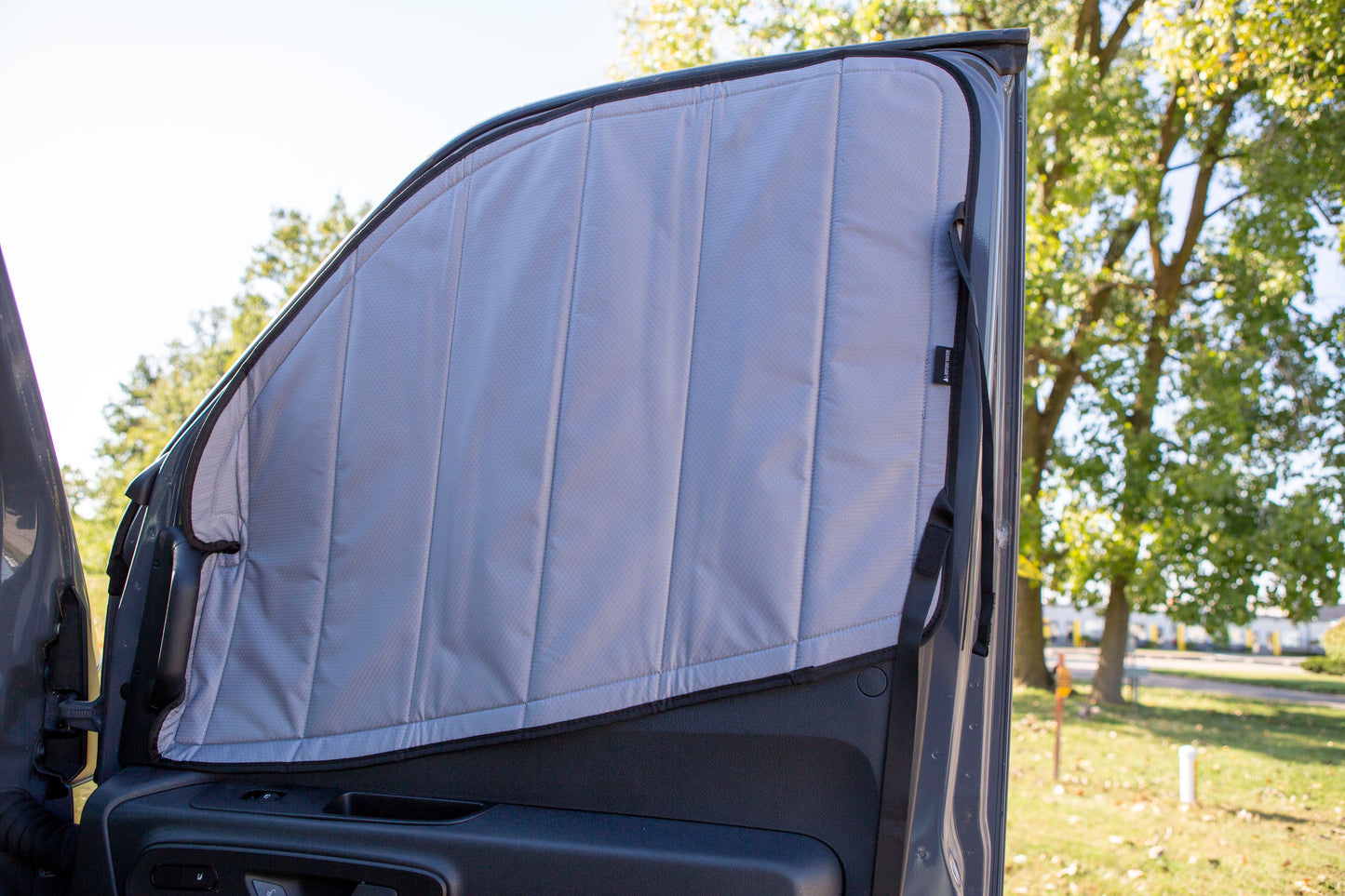 Image of the passenger side cover seamlessly attached to the passenger side window for a Sprinter van, showcasing a perfect fit and sleek installation.