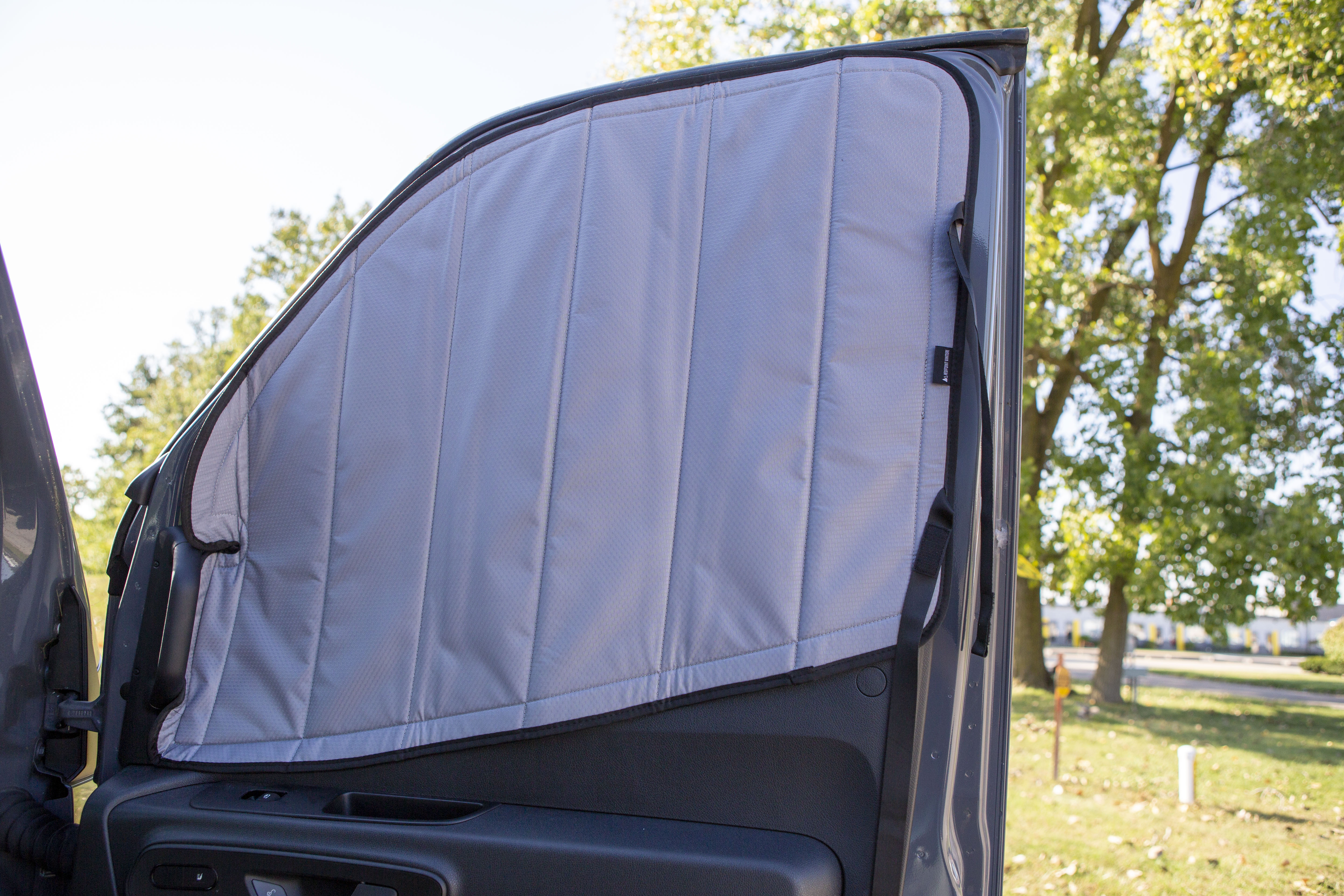 Image of the passenger side cover seamlessly attached to the passenger side window for a Sprinter van, showcasing a perfect fit and sleek installation.